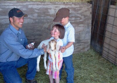 Lost Wells Cattle Company owner playimg with kids